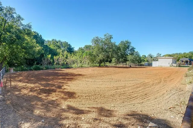 a backyard of a house with lots of green space