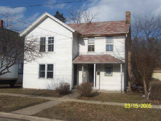 a front view of a house with a garage