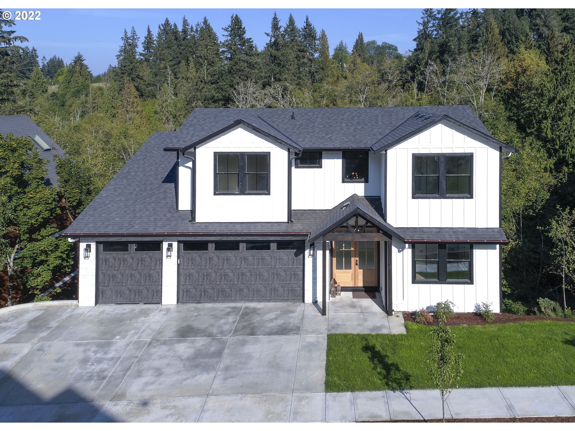 700 South 19th Place Ridgefield, WA 98642 - Photo 1 of 32 a front view of a house with a yard and garage