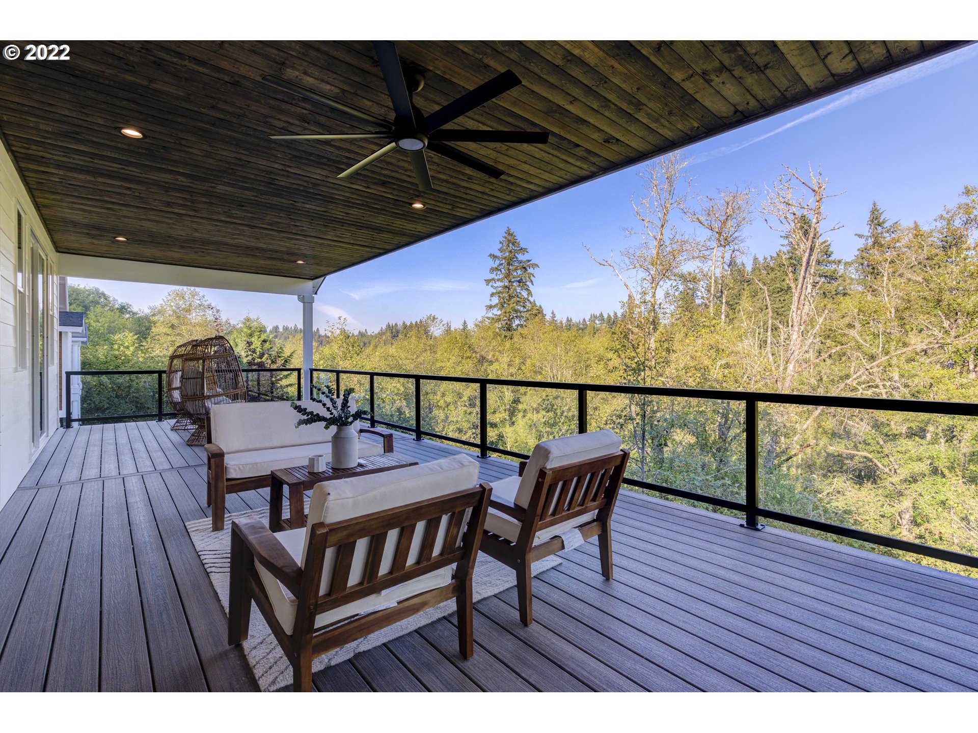 700 South 19th Place Ridgefield, WA 98642 - Photo 18 of 32 a view of a chairs and table on the wooden roof deck