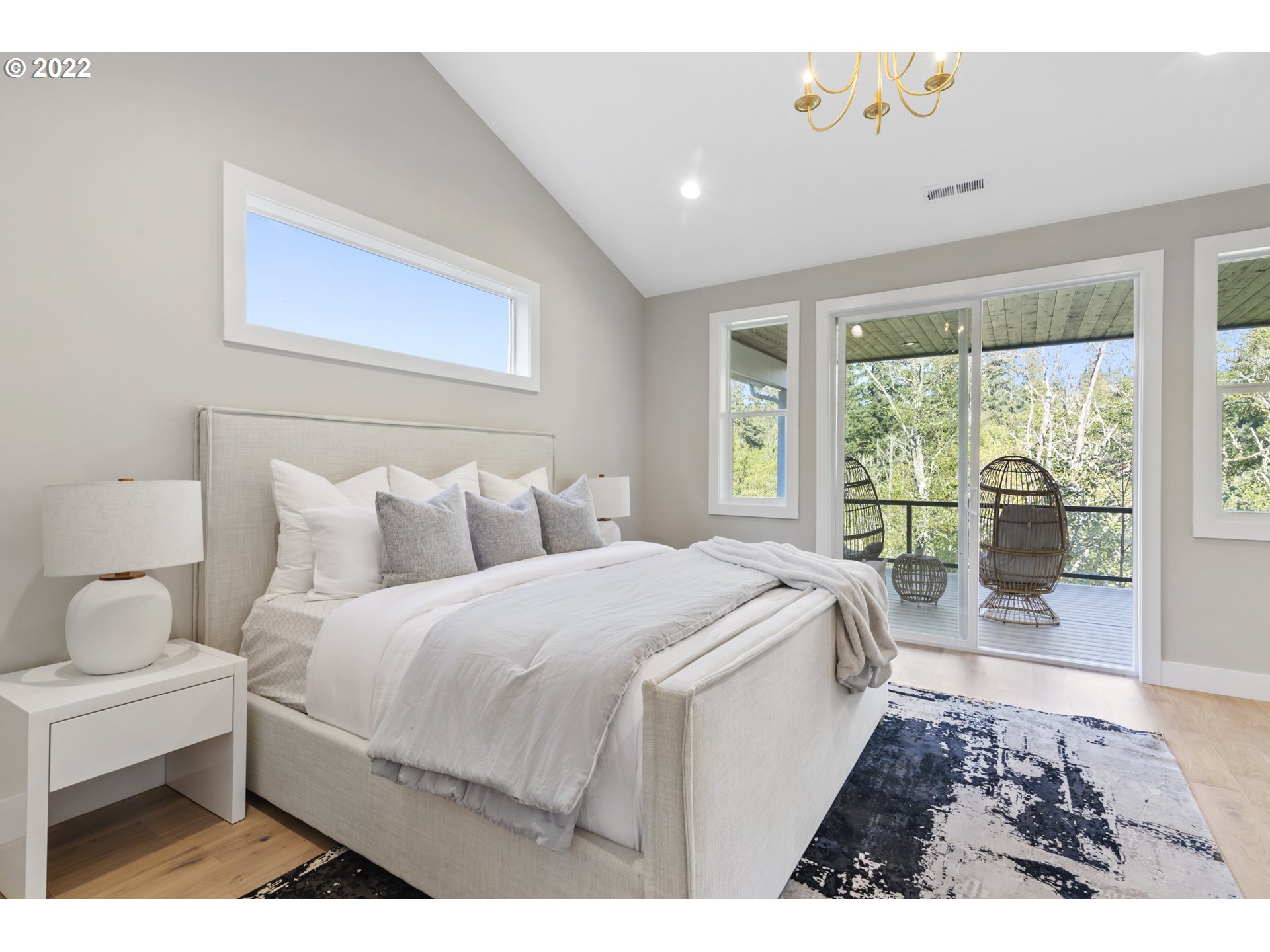 700 South 19th Place Ridgefield, WA 98642 - Photo 20 of 32 a spacious bedroom with a bed and a large window