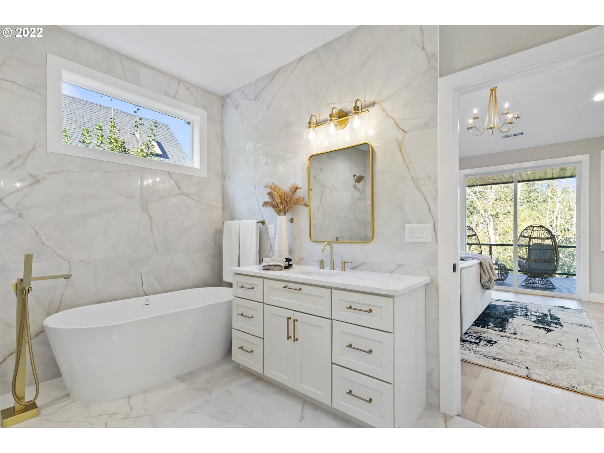 700 South 19th Place Ridgefield, WA 98642 - Photo 21 of 32 a bathroom with a tub sink and mirror