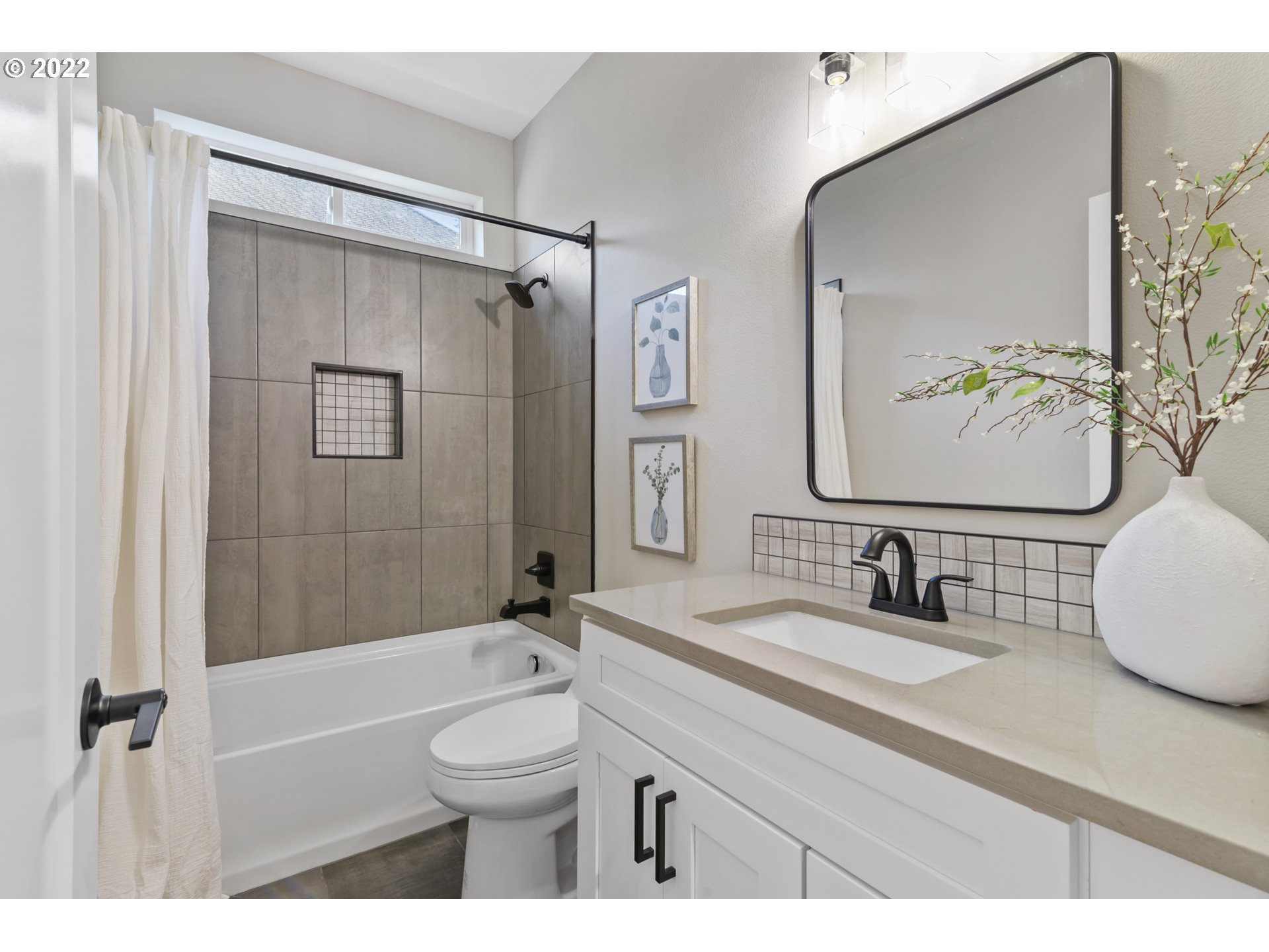 700 South 19th Place Ridgefield, WA 98642 - Photo 28 of 32 a bathroom with a double vanity sink toilet and shower