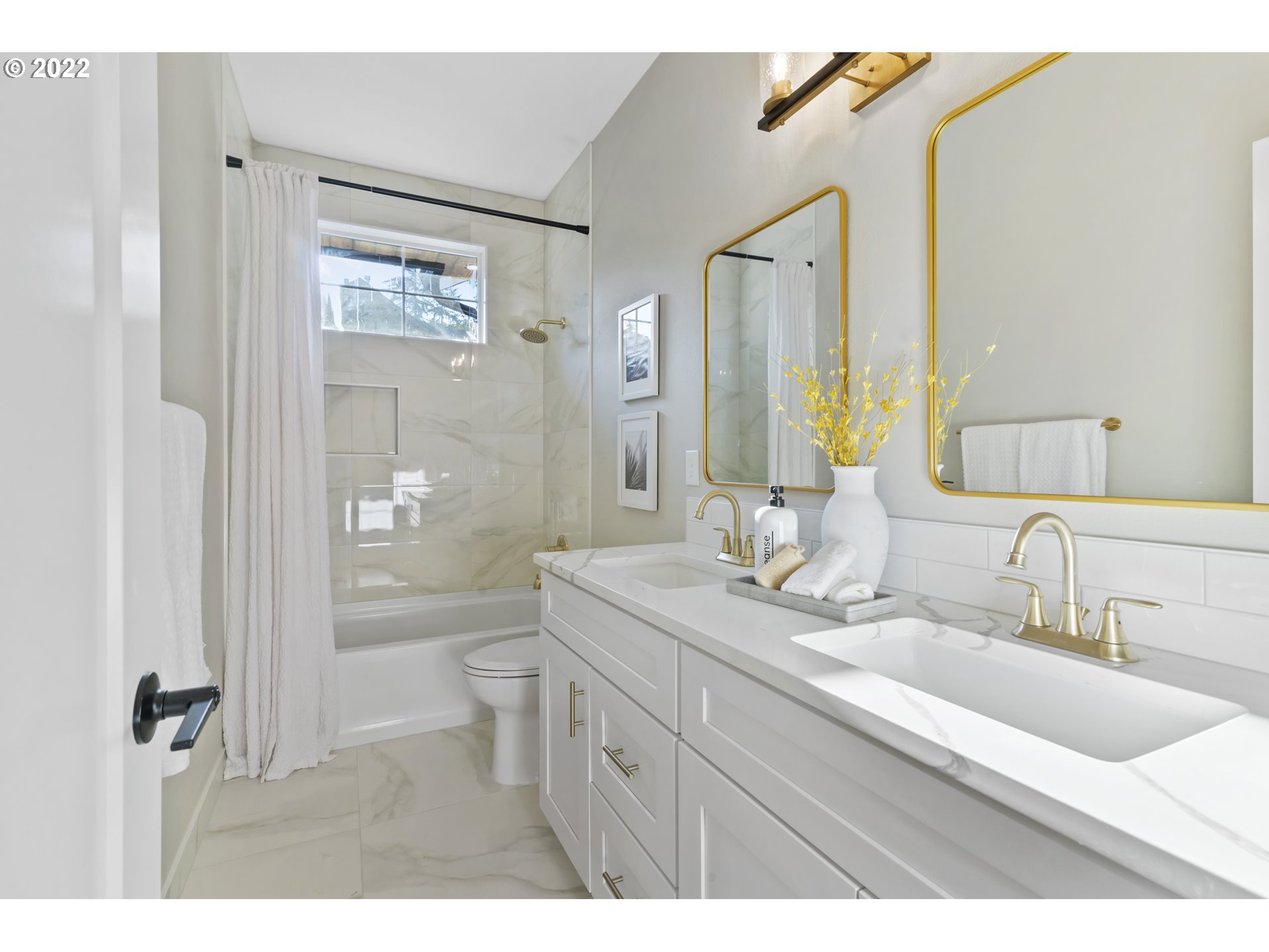 700 South 19th Place Ridgefield, WA 98642 - Photo 30 of 32 a bathroom with a double vanity sink mirror double and shower