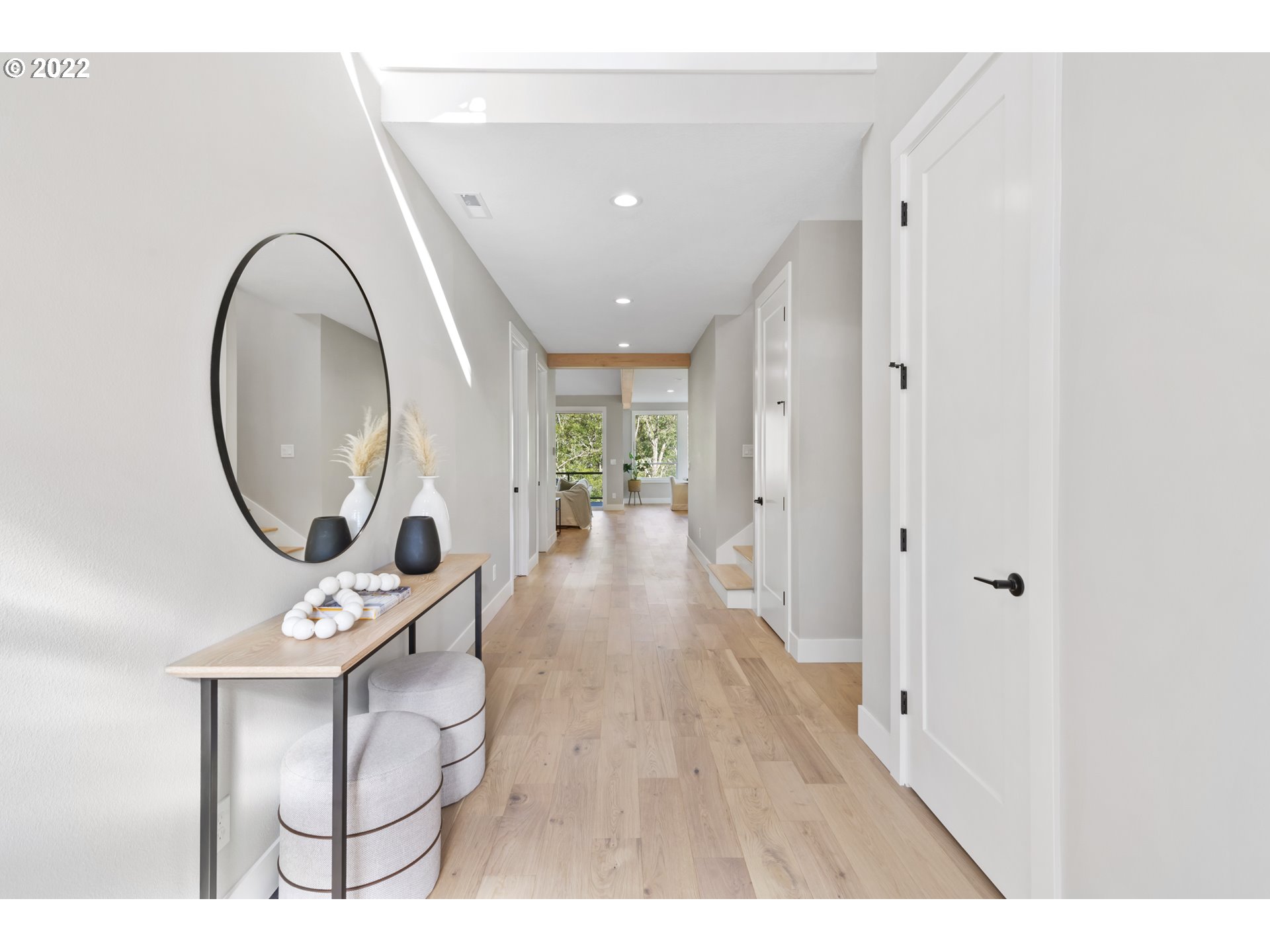 700 South 19th Place Ridgefield, WA 98642 - Photo 5 of 32 a view of a hallway with wooden floor