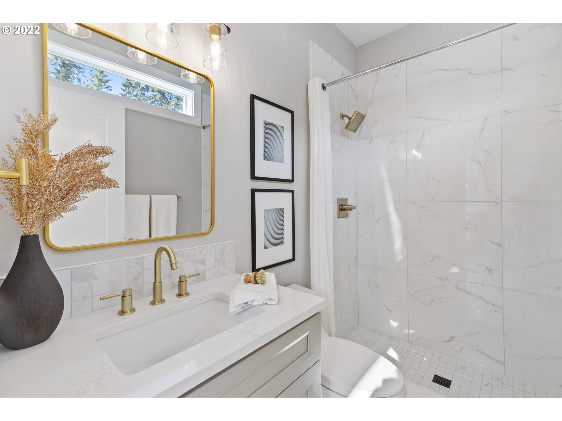 700 South 19th Place Ridgefield, WA 98642 - Photo 8 of 32 a bathroom with a sink vanity granite shower and a mirror