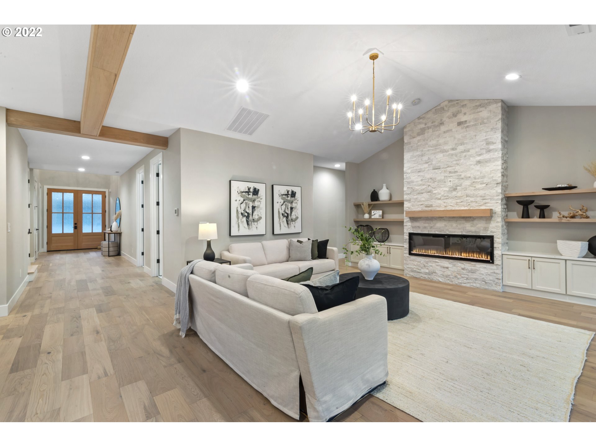 700 South 19th Place Ridgefield, WA 98642 - Photo 10 of 32 a living room with furniture wooden floor and a fireplace