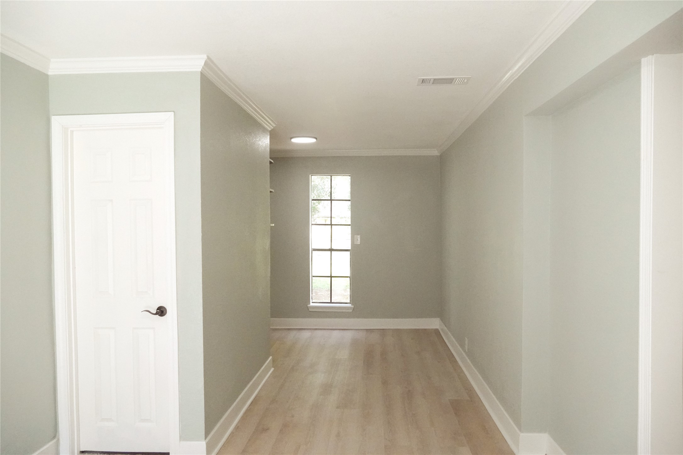 4622 Hill Side Lane Needville, TX 77461 - Photo 17 of 19 a view of empty room with wooden floor and fan