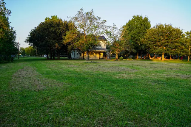 a big yard with large trees