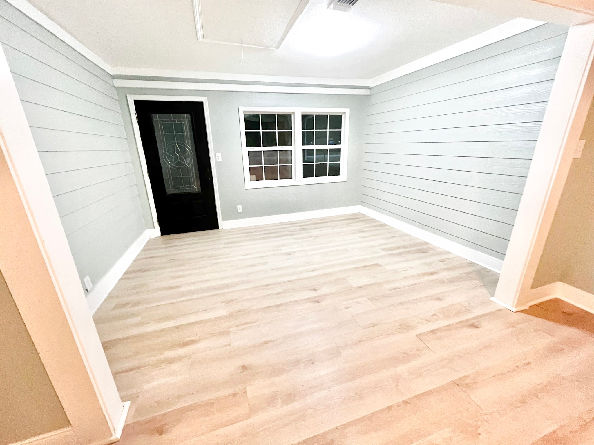 4622 Hill Side Lane Needville, TX 77461 - Photo 6 of 19 a view of an empty room with wooden floor and a window