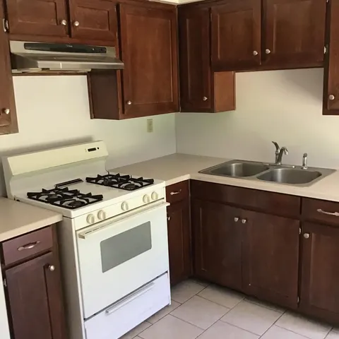 a kitchen with a stove and a sink