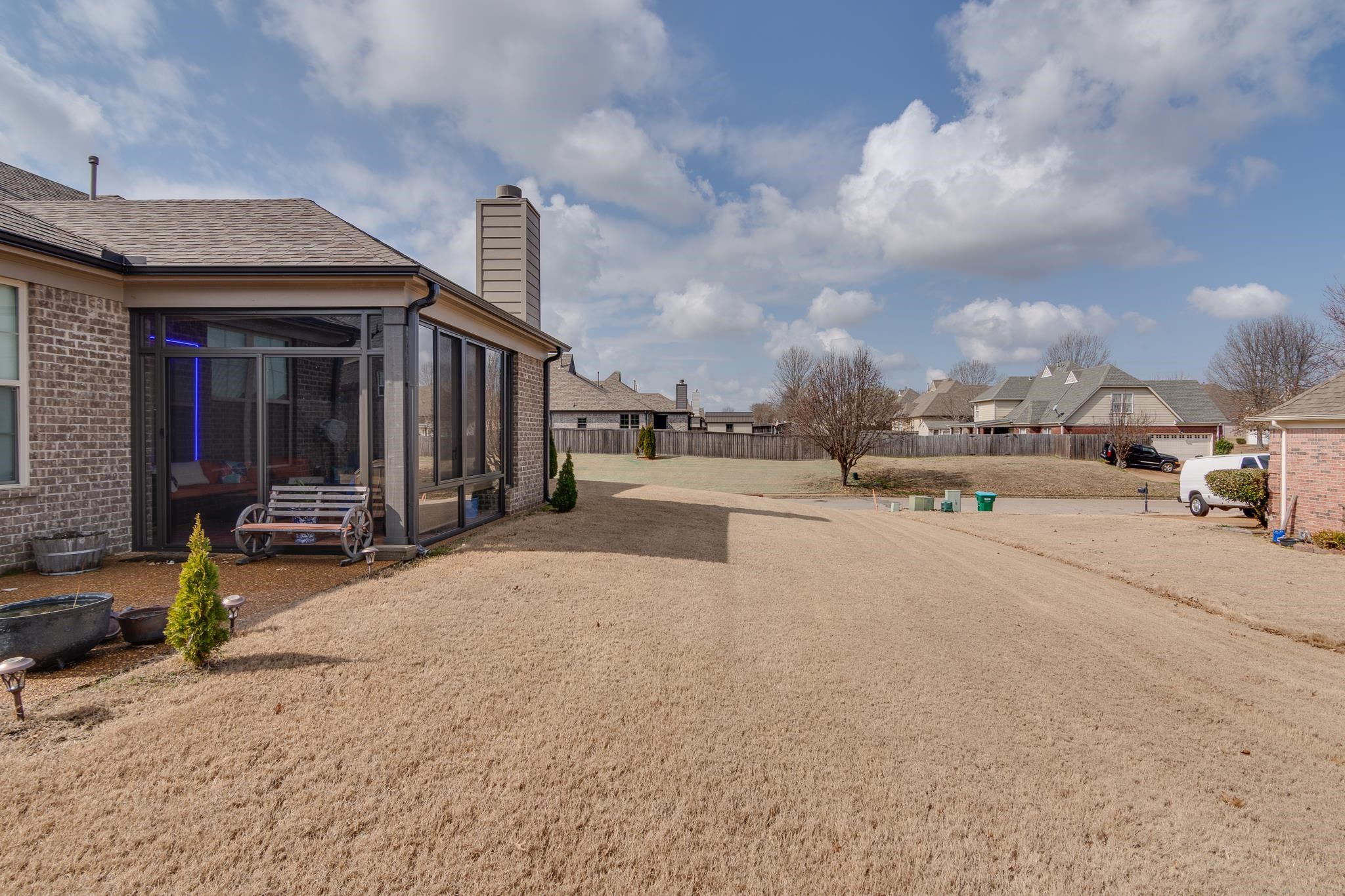 135 Chesnut Rdg Drive Oakland, TN 38060 - Photo 33 of 36 View of yard with a residential view and a sunroom