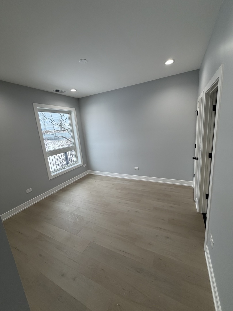 2622 West Adams Street, Unit 3 Chicago, IL 60612 - Photo 12 of 26 an empty room with windows