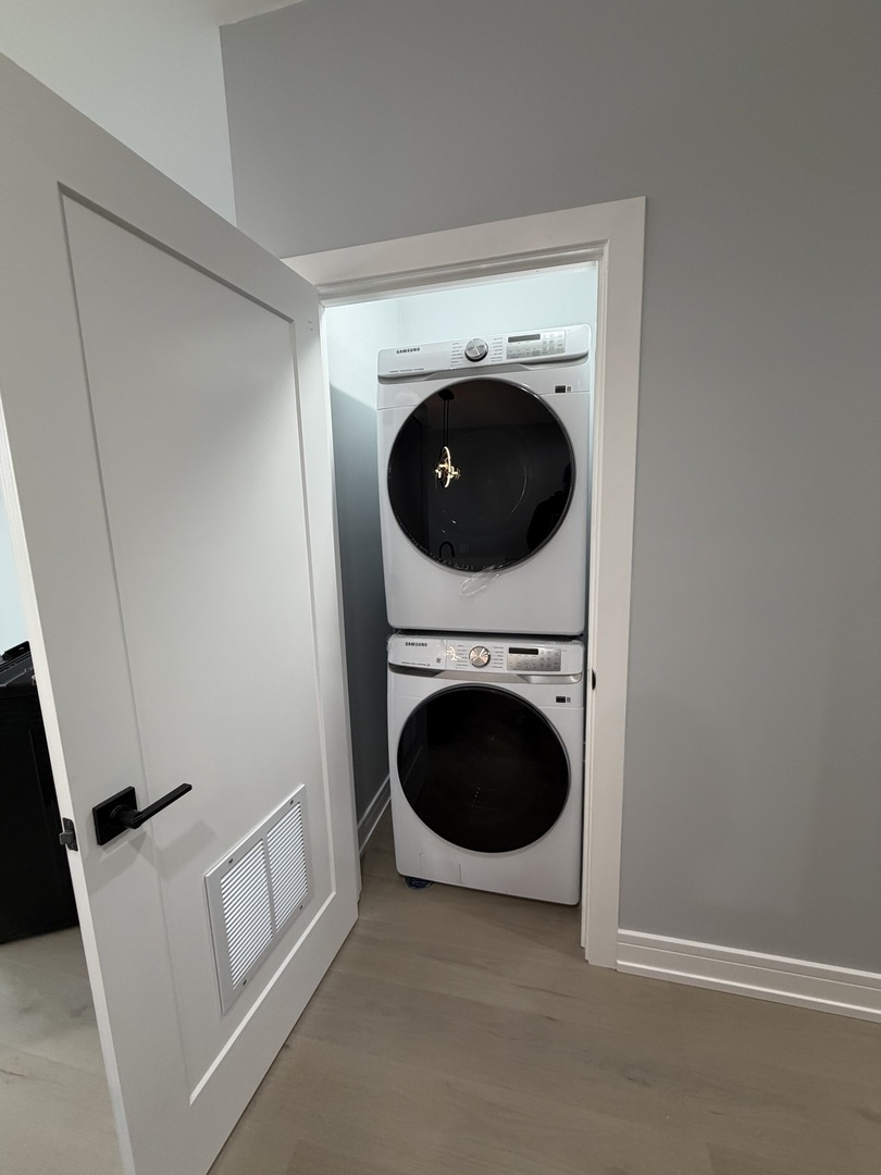 2622 West Adams Street, Unit 3 Chicago, IL 60612 - Photo 23 of 26 a view of a storage and utility room with washer and dryer