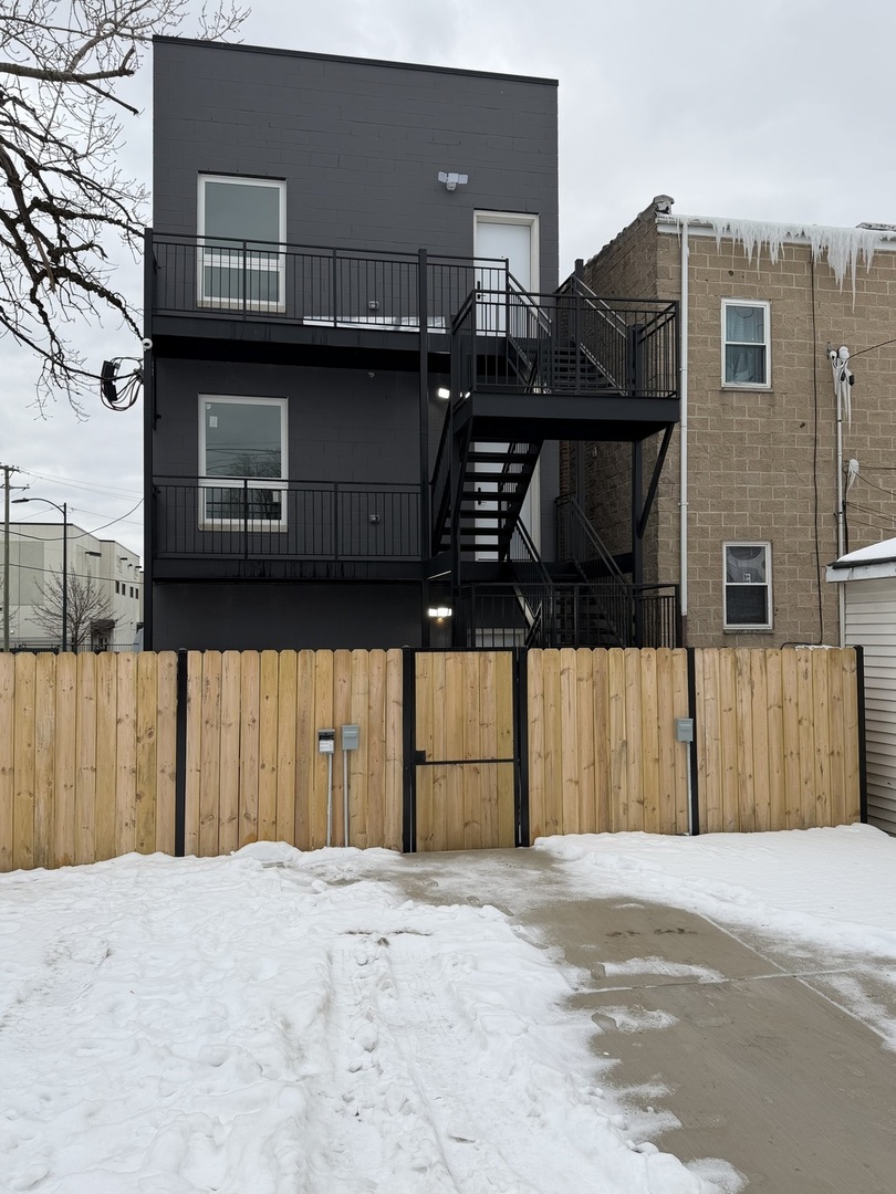 2622 West Adams Street, Unit 3 Chicago, IL 60612 - Photo 24 of 26 a front view of a house with a garage