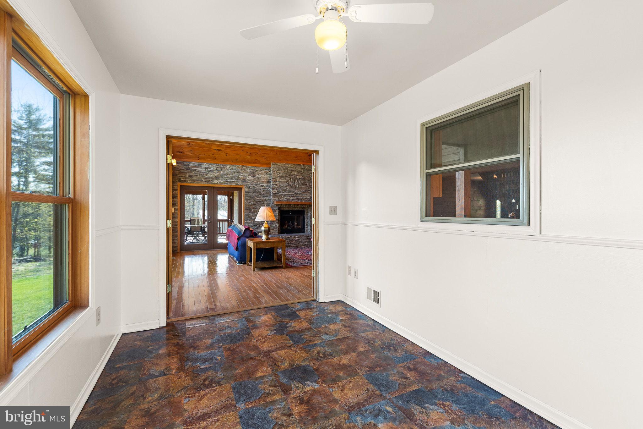 224 Oates Road Star Tannery, VA 22654 - Photo 15 of 49 Sun room opens to great room