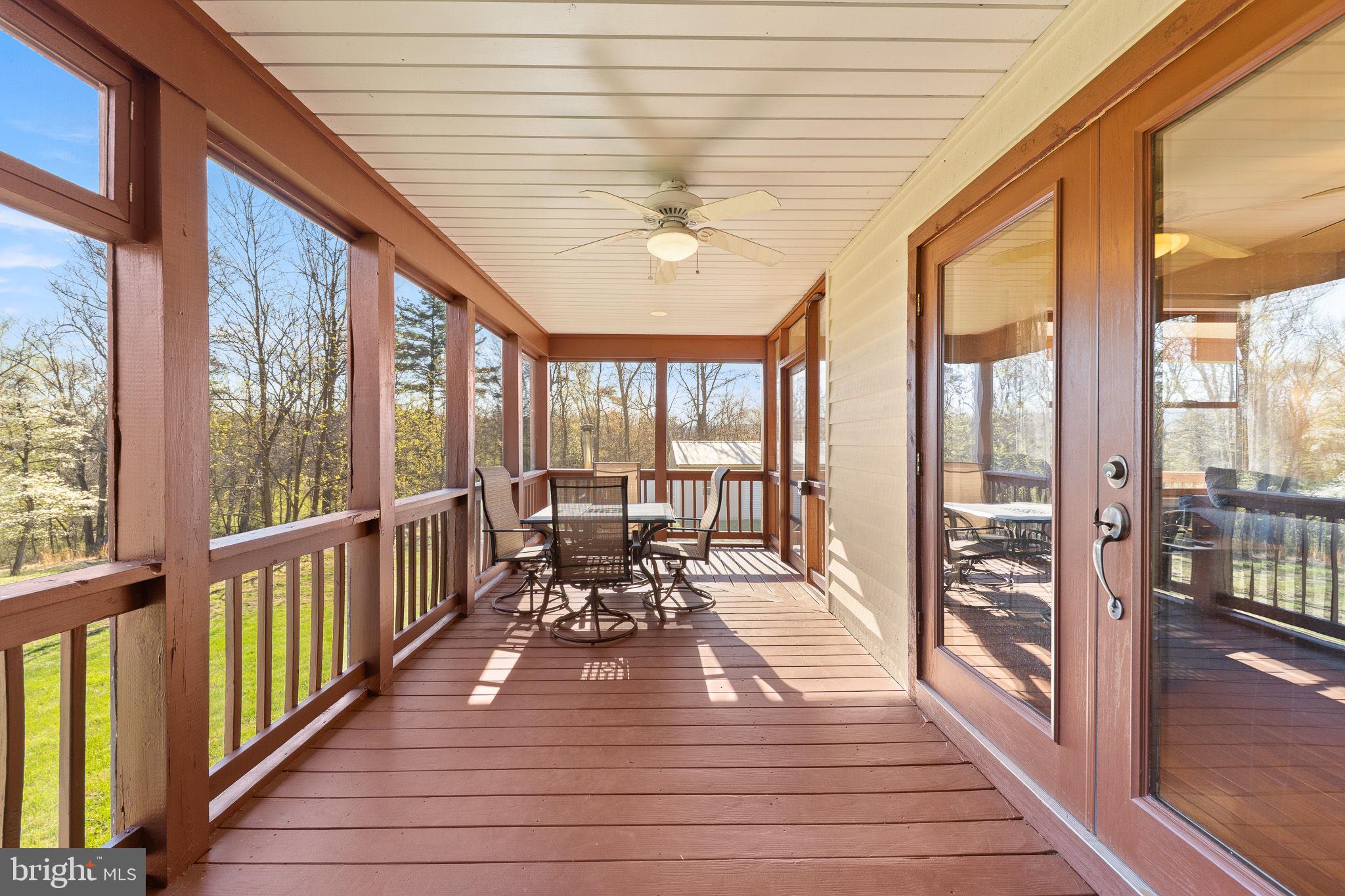 224 Oates Road Star Tannery, VA 22654 - Photo 23 of 49 Screened porch off TV room