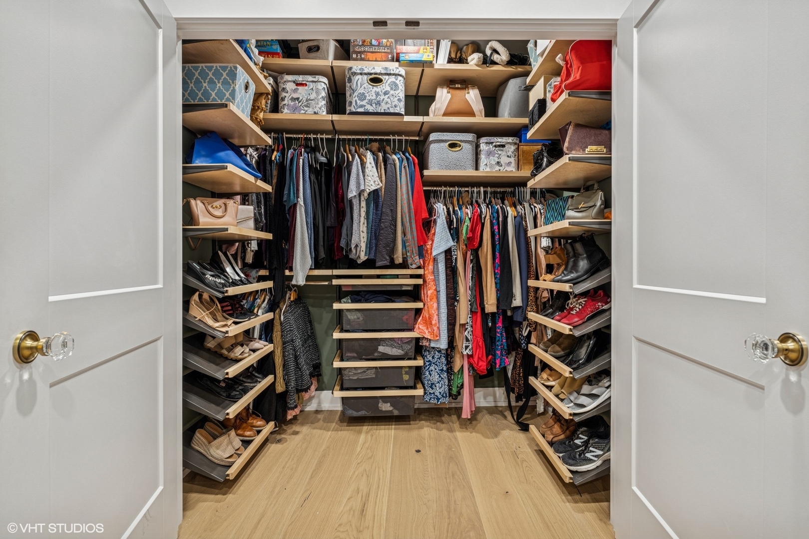 5103 North Clark Street, Unit 2 Chicago, IL 60640 - Photo 14 of 21 a view of walk in closet with clothes and shoes