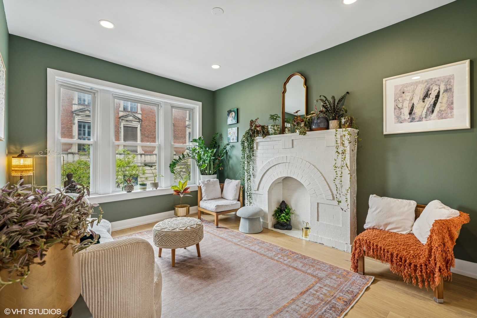 5103 North Clark Street, Unit 2 Chicago, IL 60640 - Photo 17 of 21 a living room with furniture a large window and a fireplace
