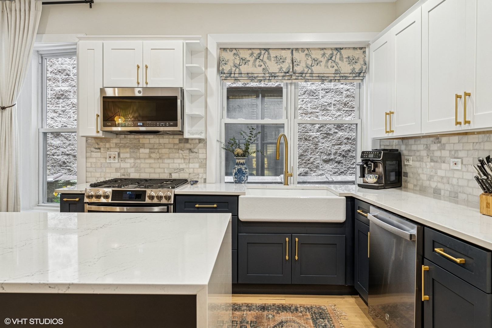 5103 North Clark Street, Unit 2 Chicago, IL 60640 - Photo 4 of 21 a kitchen with stainless steel appliances granite countertop a stove a sink and a microwave