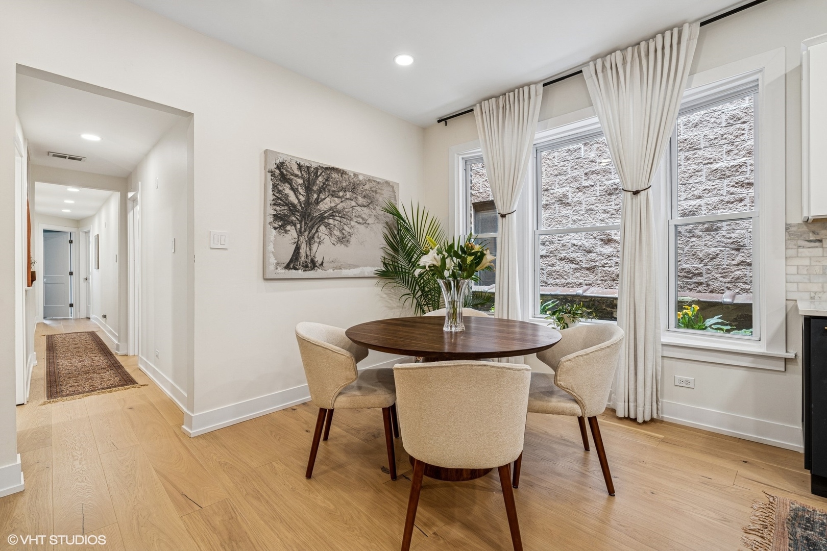 5103 North Clark Street, Unit 2 Chicago, IL 60640 - Photo 8 of 21 a dining room with furniture and wooden floor