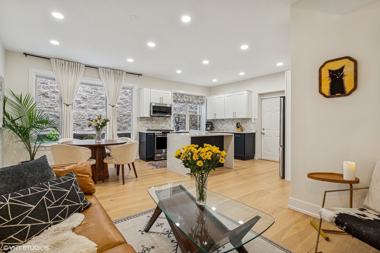 5103 North Clark Street, Unit 2 Chicago, IL 60640 - Photo 10 of 21 a living room with stainless steel appliances furniture and a kitchen view