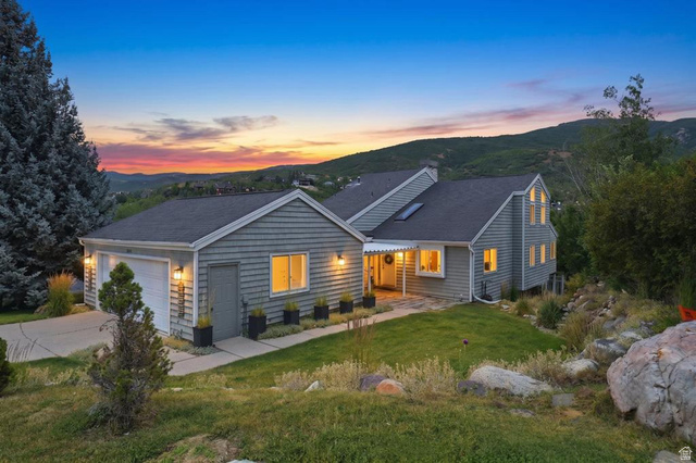 1979 Cave Hollow Way Bountiful, UT 84010 - Photo 48 of 59 Siding exterior with multiple gables and a two-car garage