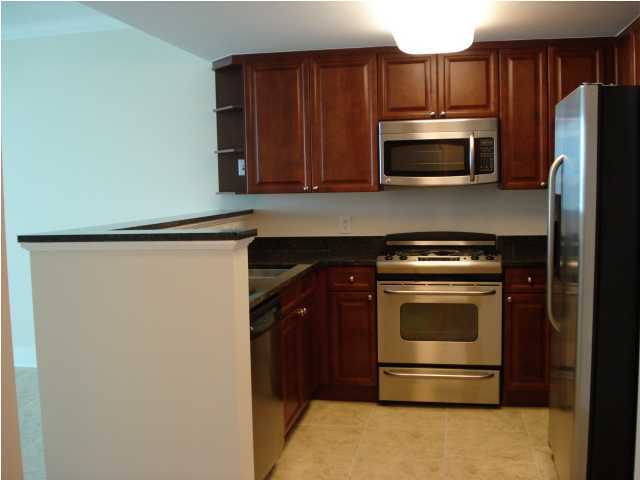 1110 Santa Rosa Boulevard, Unit A622 Fort Walton Beach, FL 32548 - Photo 2 of 27 a kitchen with a stove microwave and refrigerator