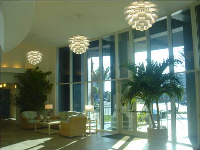 1110 Santa Rosa Boulevard, Unit A622 Fort Walton Beach, FL 32548 - Photo 24 of 27 a living room with patio furniture and a chandelier