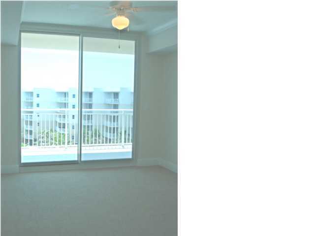 1110 Santa Rosa Boulevard, Unit A622 Fort Walton Beach, FL 32548 - Photo 5 of 27 a view of a livingroom with a floor to ceiling window and wooden floor