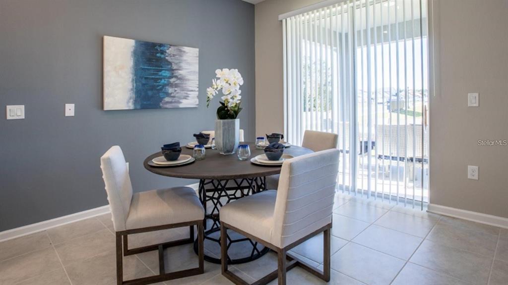 643 Grove Street Winter Haven, FL 33881 - Photo 14 of 16 a view of a dining room with furniture and chandelier