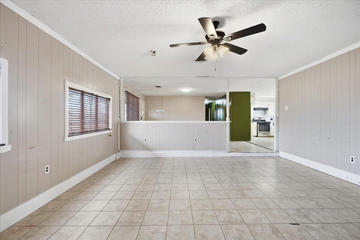 5401 41st Street Lubbock, TX 79414 - Photo 5 of 24 a view of a livingroom with a ceiling fan and window