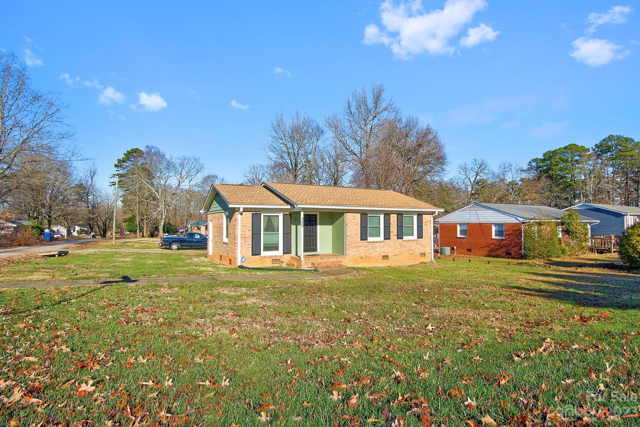 300 Newsome Road Salisbury, NC 28146 - Photo 1 of 27 a front view of a house with a garden