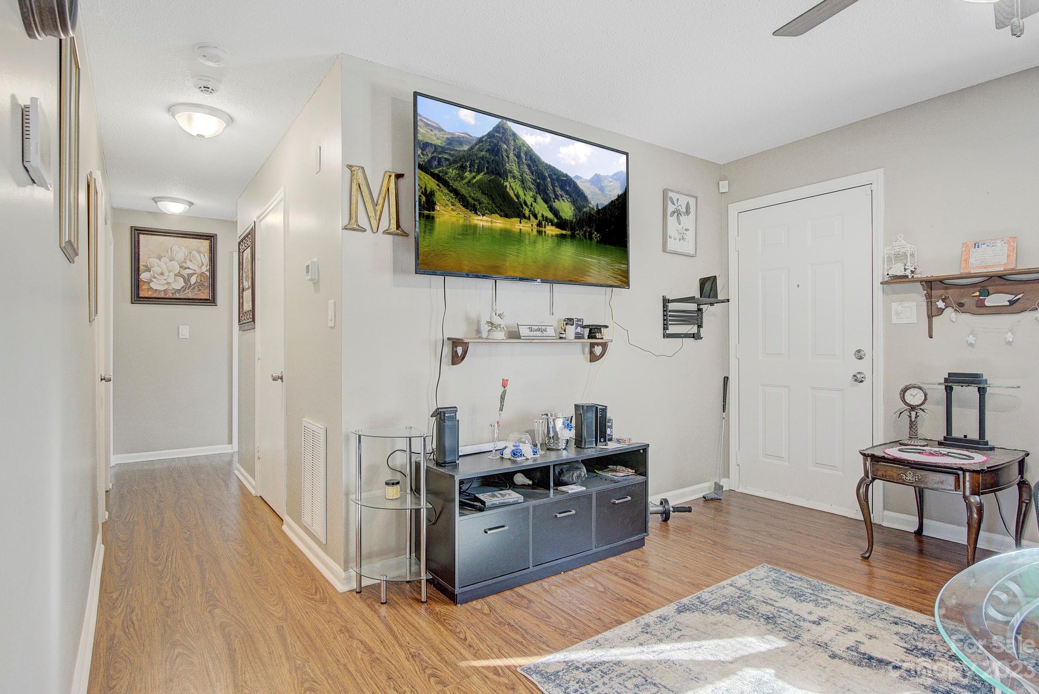 300 Newsome Road Salisbury, NC 28146 - Photo 11 of 27 a living room with stainless steel appliances furniture and a flat screen tv