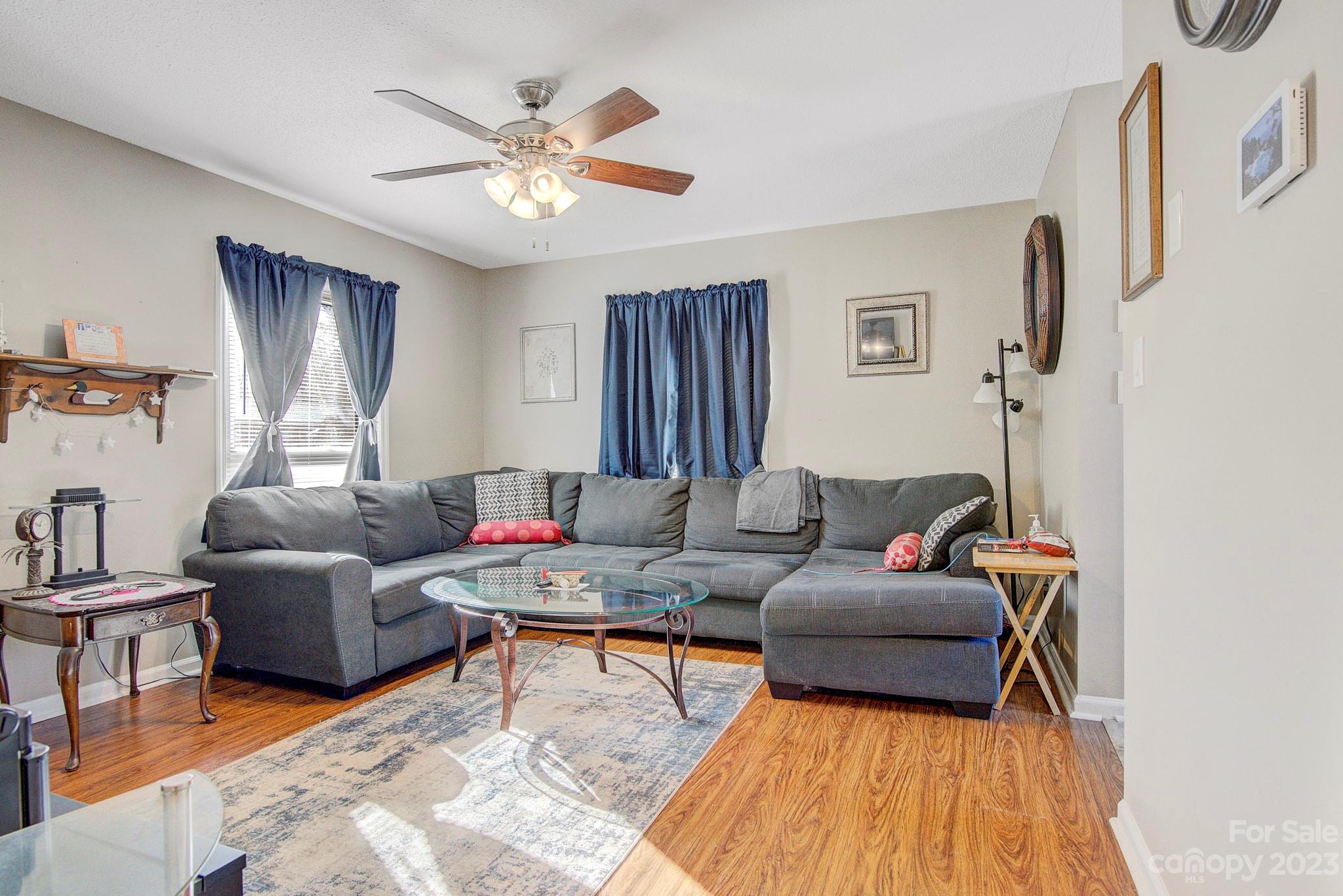 300 Newsome Road Salisbury, NC 28146 - Photo 12 of 27 a living room with furniture and a chandelier