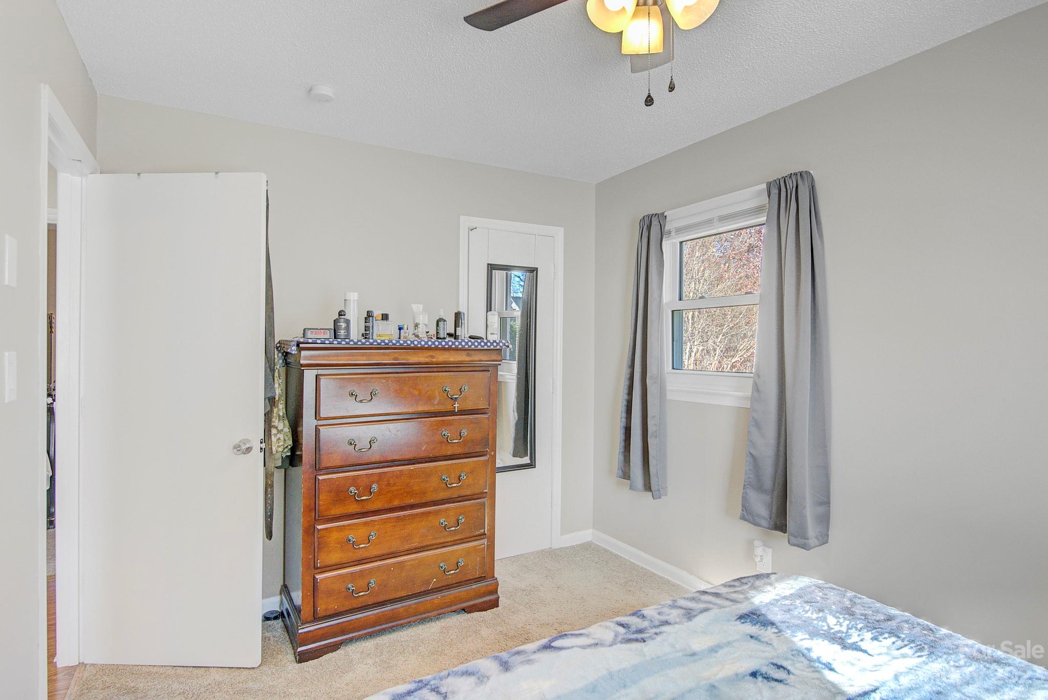 300 Newsome Road Salisbury, NC 28146 - Photo 15 of 27 a view of a bedroom with closet and cabinet