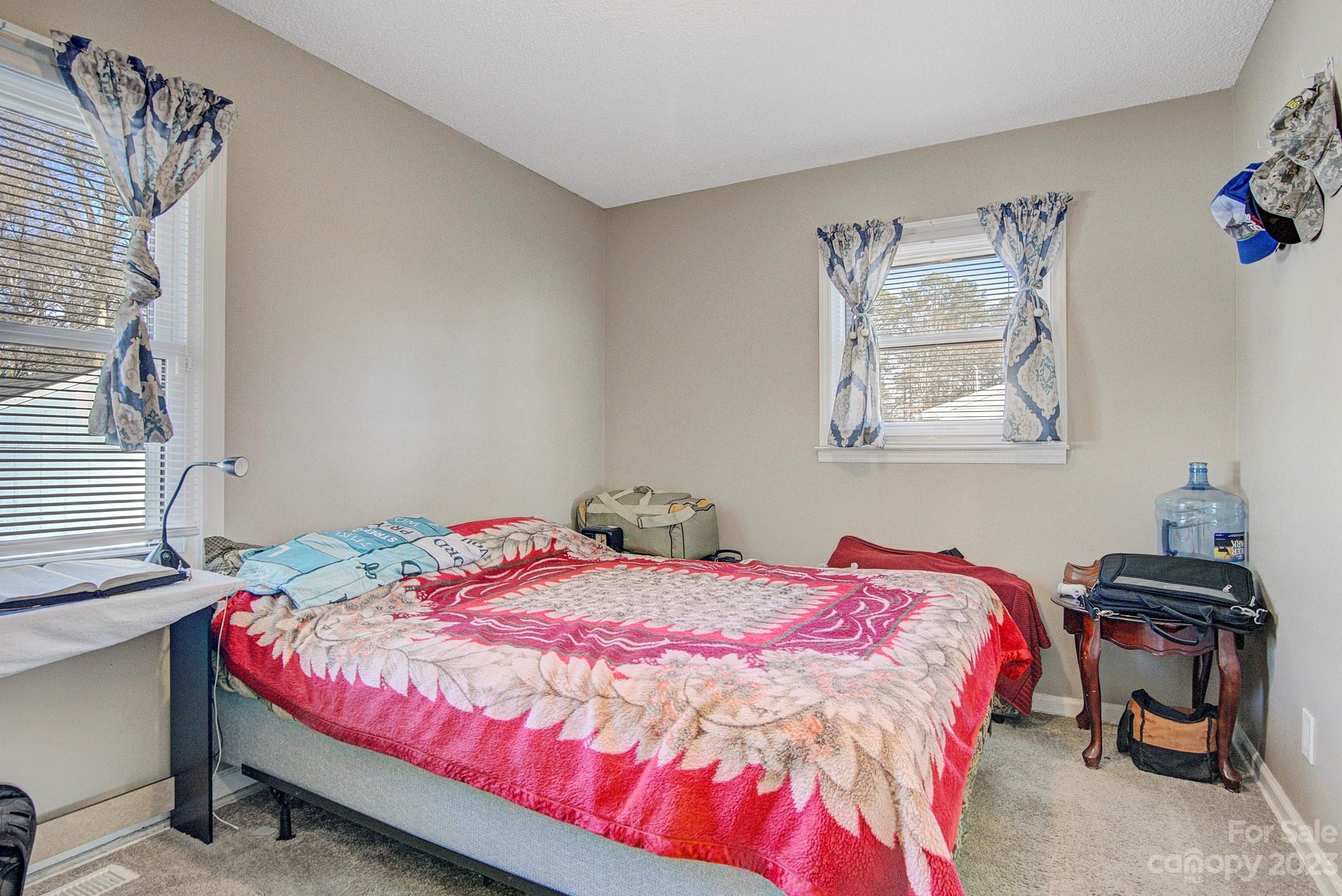 300 Newsome Road Salisbury, NC 28146 - Photo 19 of 27 a bedroom with a bed and a lamp