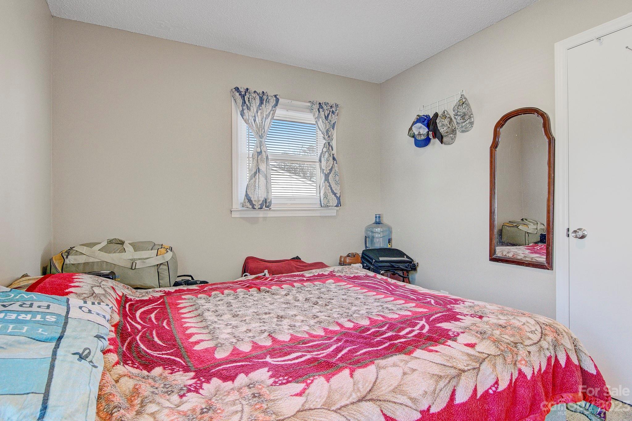 300 Newsome Road Salisbury, NC 28146 - Photo 20 of 27 a bedroom with a bed and a dresser
