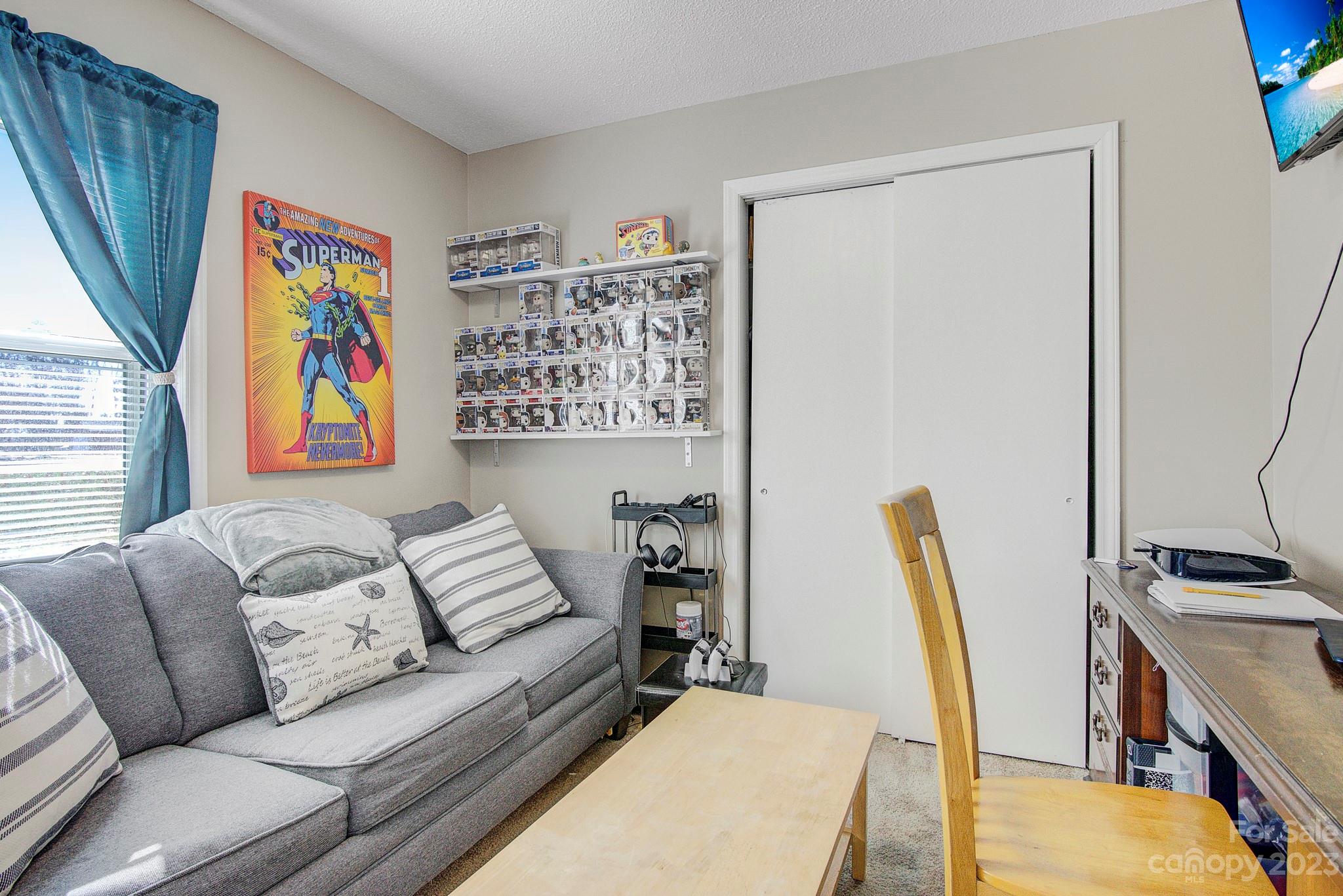 300 Newsome Road Salisbury, NC 28146 - Photo 21 of 27 a living room with furniture and a flat screen tv