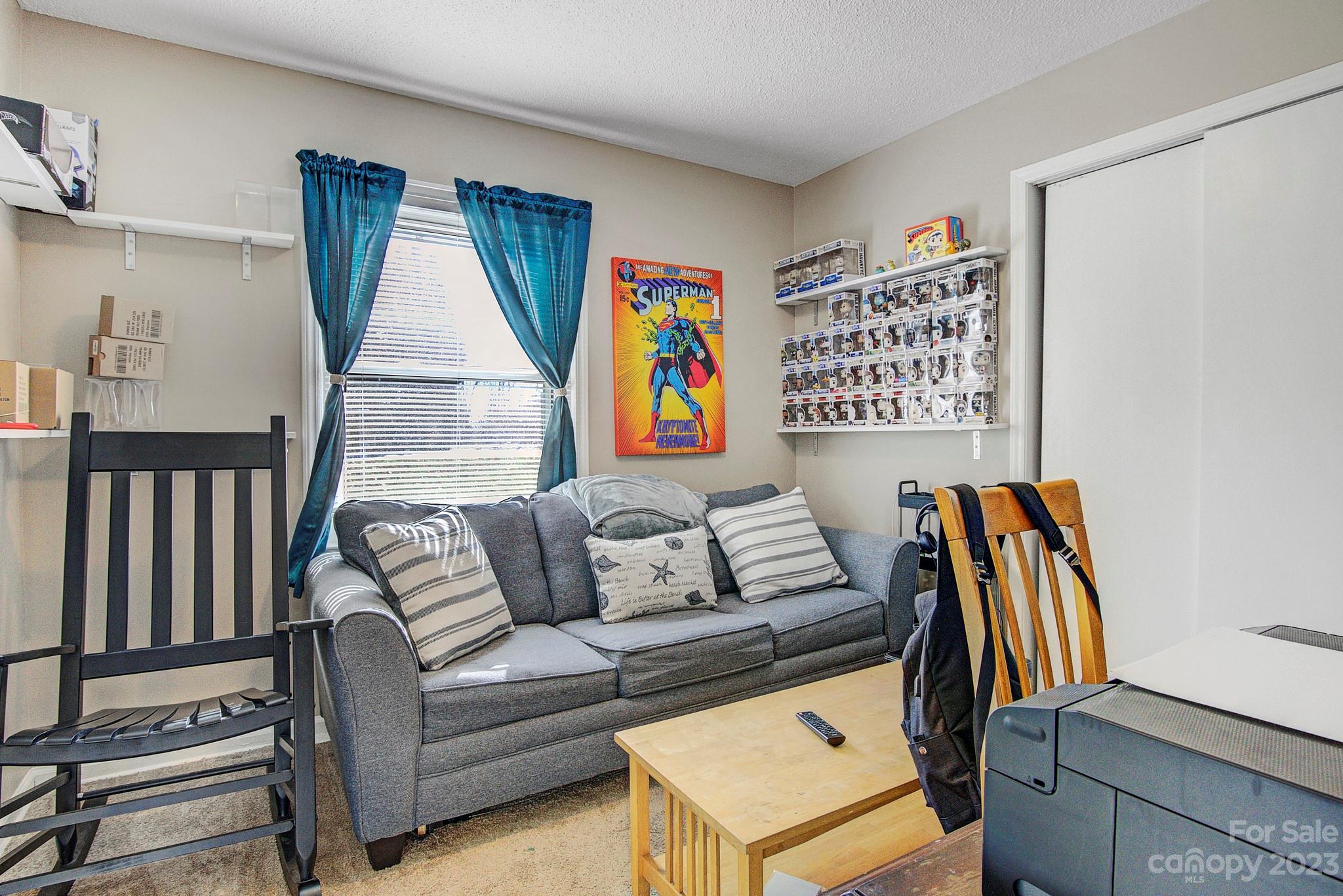 300 Newsome Road Salisbury, NC 28146 - Photo 22 of 27 a living room with furniture a window and wooden floor