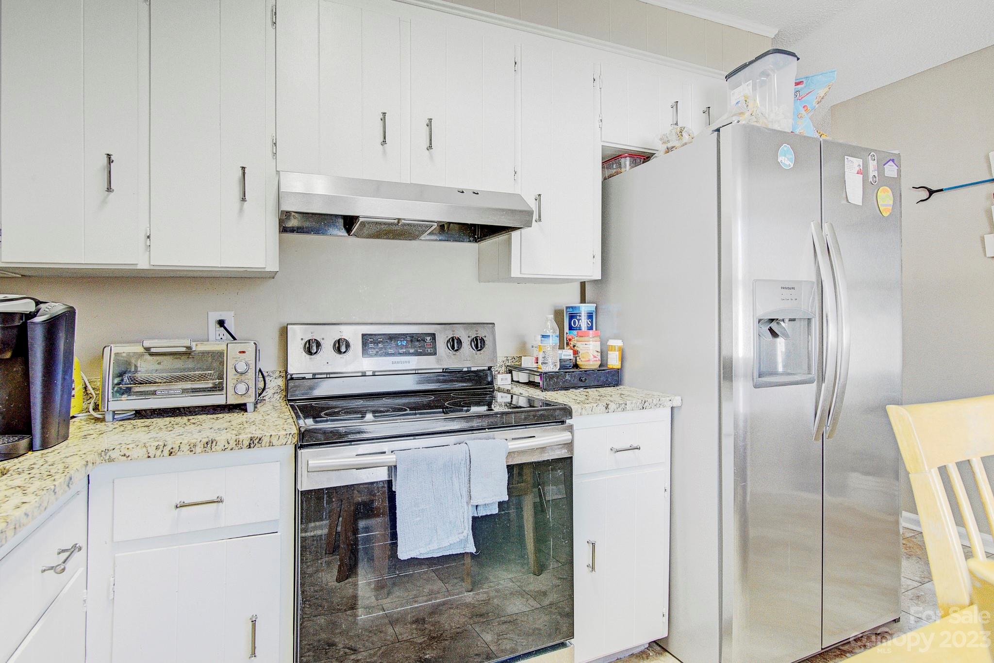 300 Newsome Road Salisbury, NC 28146 - Photo 27 of 27 a kitchen with stainless steel appliances granite countertop a refrigerator stove and sink