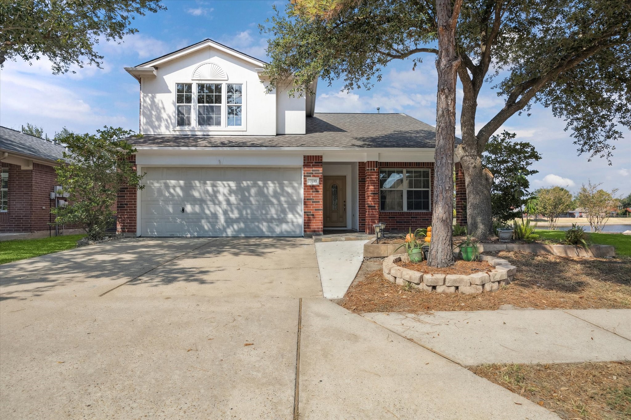 17610 Prospect Meadows Drive Houston, TX 77095 - Photo 1 of 33 a front view of a house with a yard and garage