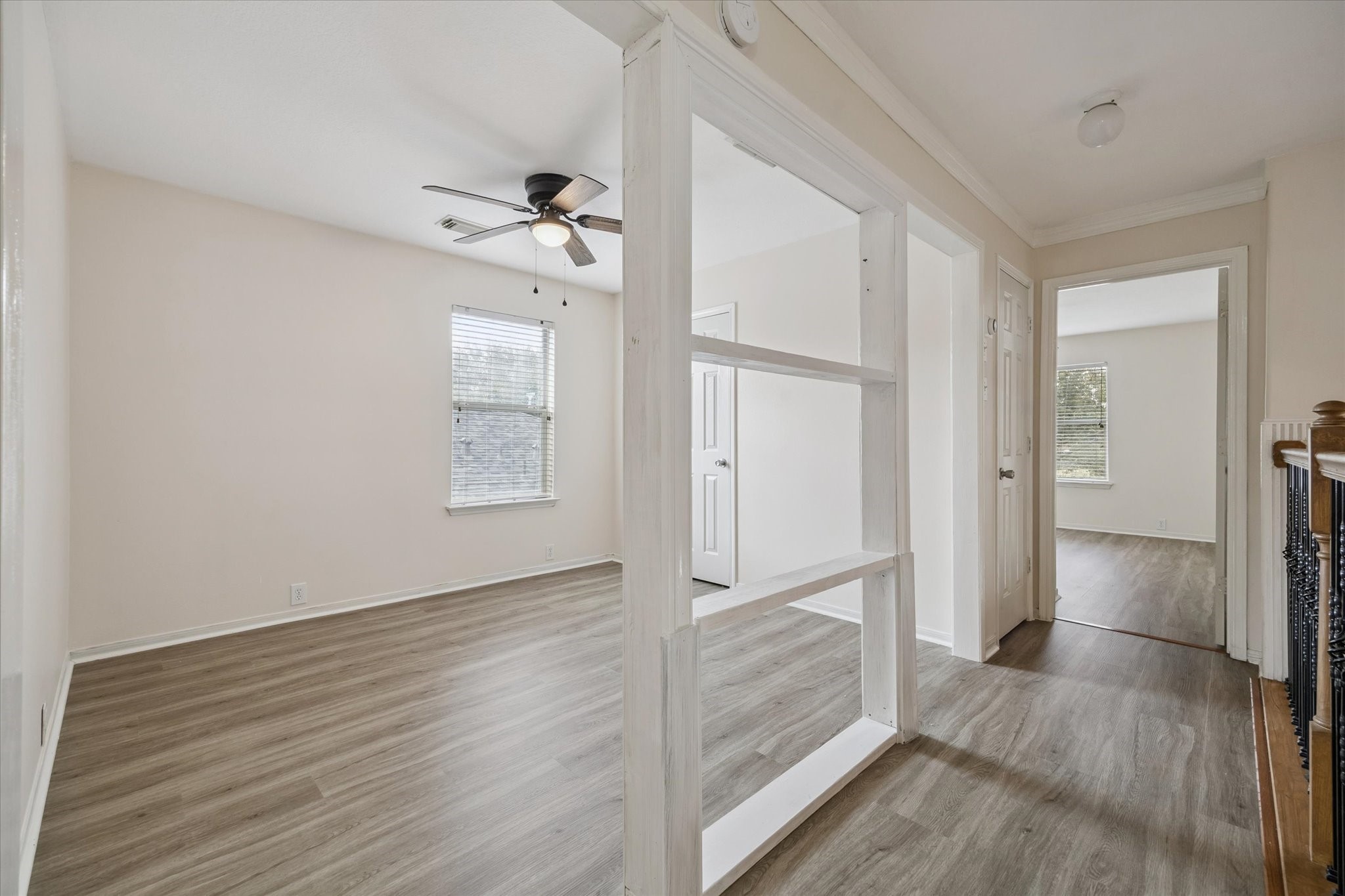 17610 Prospect Meadows Drive Houston, TX 77095 - Photo 19 of 33 a view of a hallway view with wooden floor and staircase