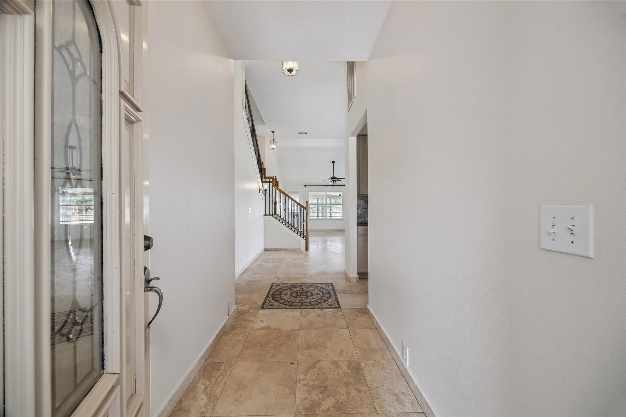 17610 Prospect Meadows Drive Houston, TX 77095 - Photo 6 of 33 a view of a hallway with wooden floor and staircase