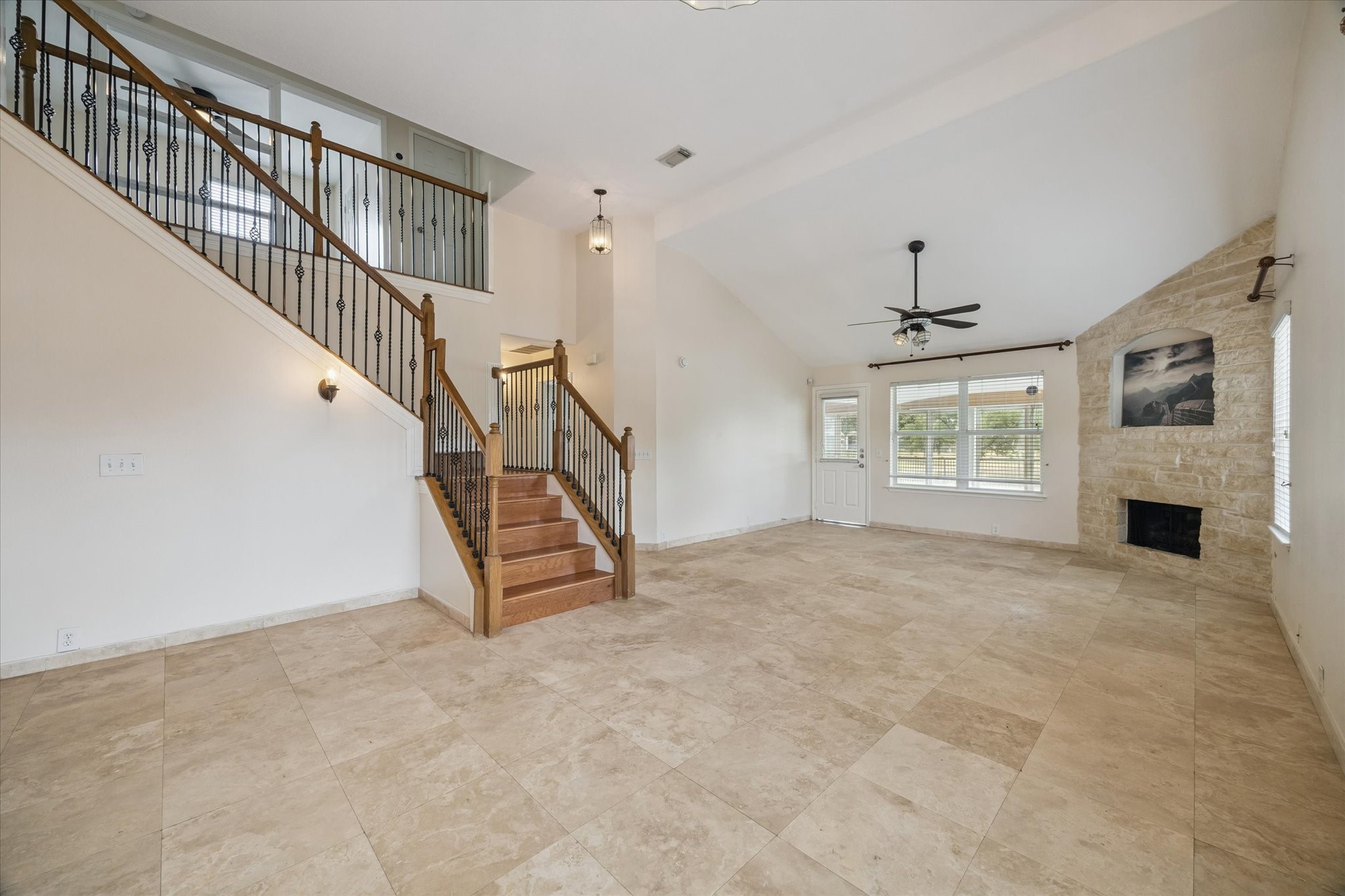 17610 Prospect Meadows Drive Houston, TX 77095 - Photo 8 of 33 a view of an empty room with a fireplace and a window