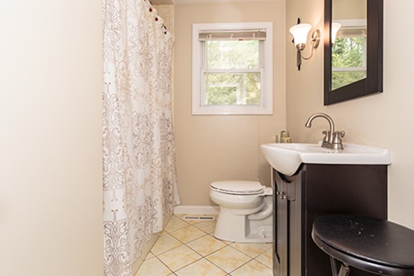 11 Garland Road Chelmsford, MA 01824 - Photo 11 of 19 a bathroom with a toilet sink and mirror