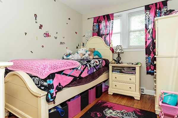 11 Garland Road Chelmsford, MA 01824 - Photo 12 of 19 a bed room with a bed and a baby crib