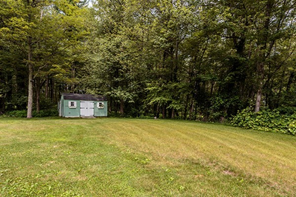 11 Garland Road Chelmsford, MA 01824 - Photo 13 of 19 a house with trees in front of it