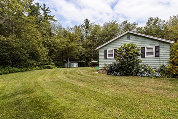 11 Garland Road Chelmsford, MA 01824 - Photo 14 of 19 a view of backyard of house with green space