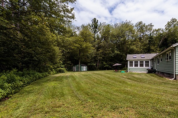 11 Garland Road Chelmsford, MA 01824 - Photo 15 of 19 a backyard of a house with yard and trampoline